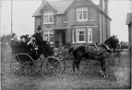 John and the rest of the family including Mrs Harling, their hired help, off in the family 'brake', for a day out.