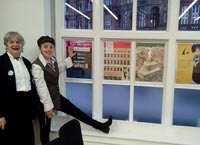 Hazel Roy and Charlotte Bill in front of Crusade Posters.