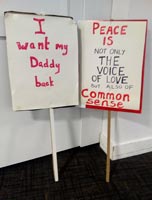 Two placards used in the film
