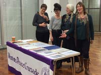 Volunteers and visitor with some of the resources from the project