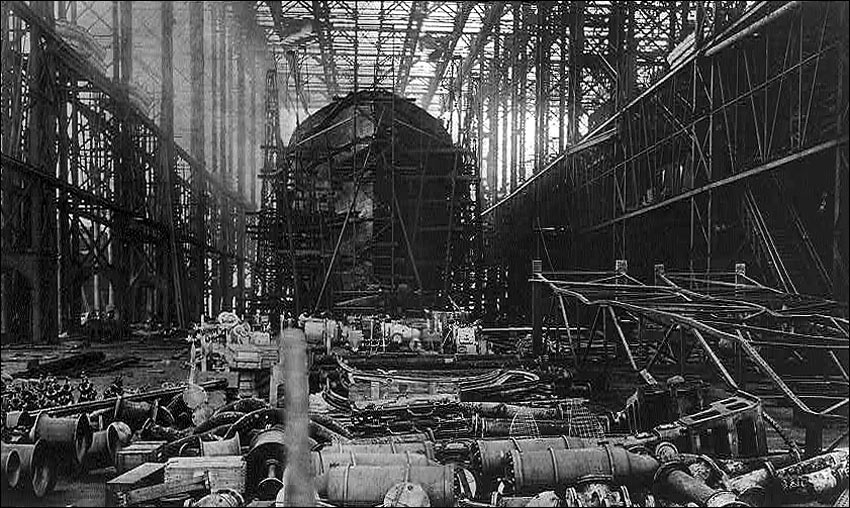 "Britain's ever-growing Navy: a huge destroyer on the stocks in a naval ship-building yard"