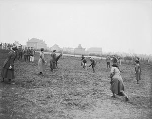 Women's Auxiliary Army Corps: WAACs and convalescent soldiers playing cricket in the camp at Etaples, France.