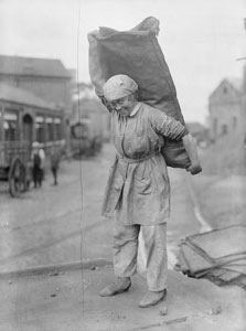 Women Gas workers carrying 1 cwt. sack of coke, South Metropolitan Gas Co., 709, Old Kent Road, June 1918