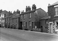 Frontage of the 'back-to-back, over and under' dwellings on Lees Road, Oldham.