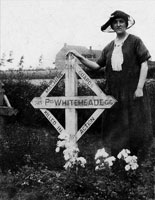 Edward's sistar, Martha, on a visit to his memorial at Duhallows Cemetery.