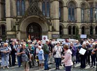 Crowds gathering with name placards