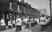 Frank Taylor carrying the Processional Cross circa 1923